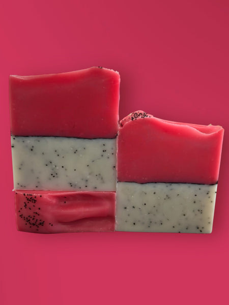 Sultry Scents Dragon Fruit Soap Bar with pink and white layers and black seeds on pink background