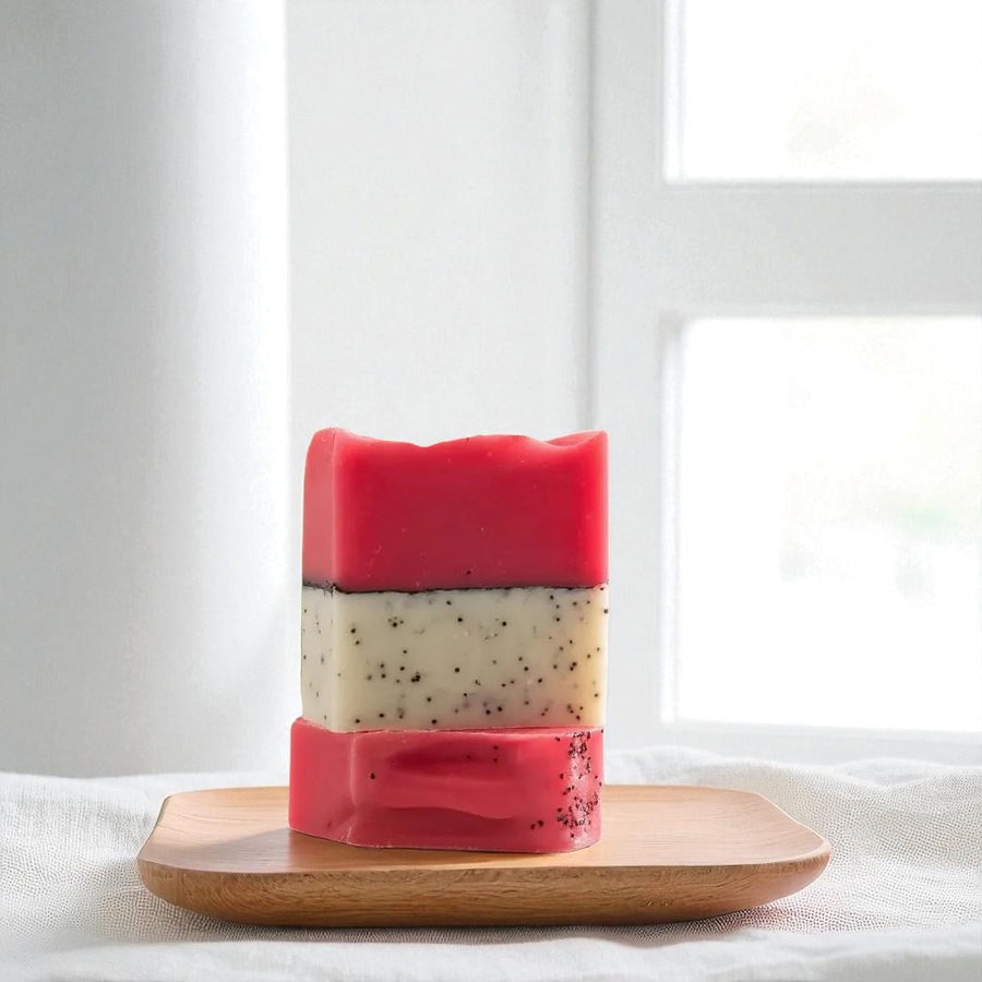 Sultry Scents Dragon Fruit Soap Bar with hot pink and white layers featuring natural exfoliating seeds on wooden tray