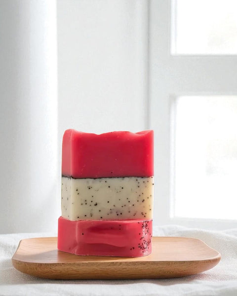 Sultry Scents Dragon Fruit Soap Bar with hot pink and white layers featuring natural exfoliating seeds on wooden tray