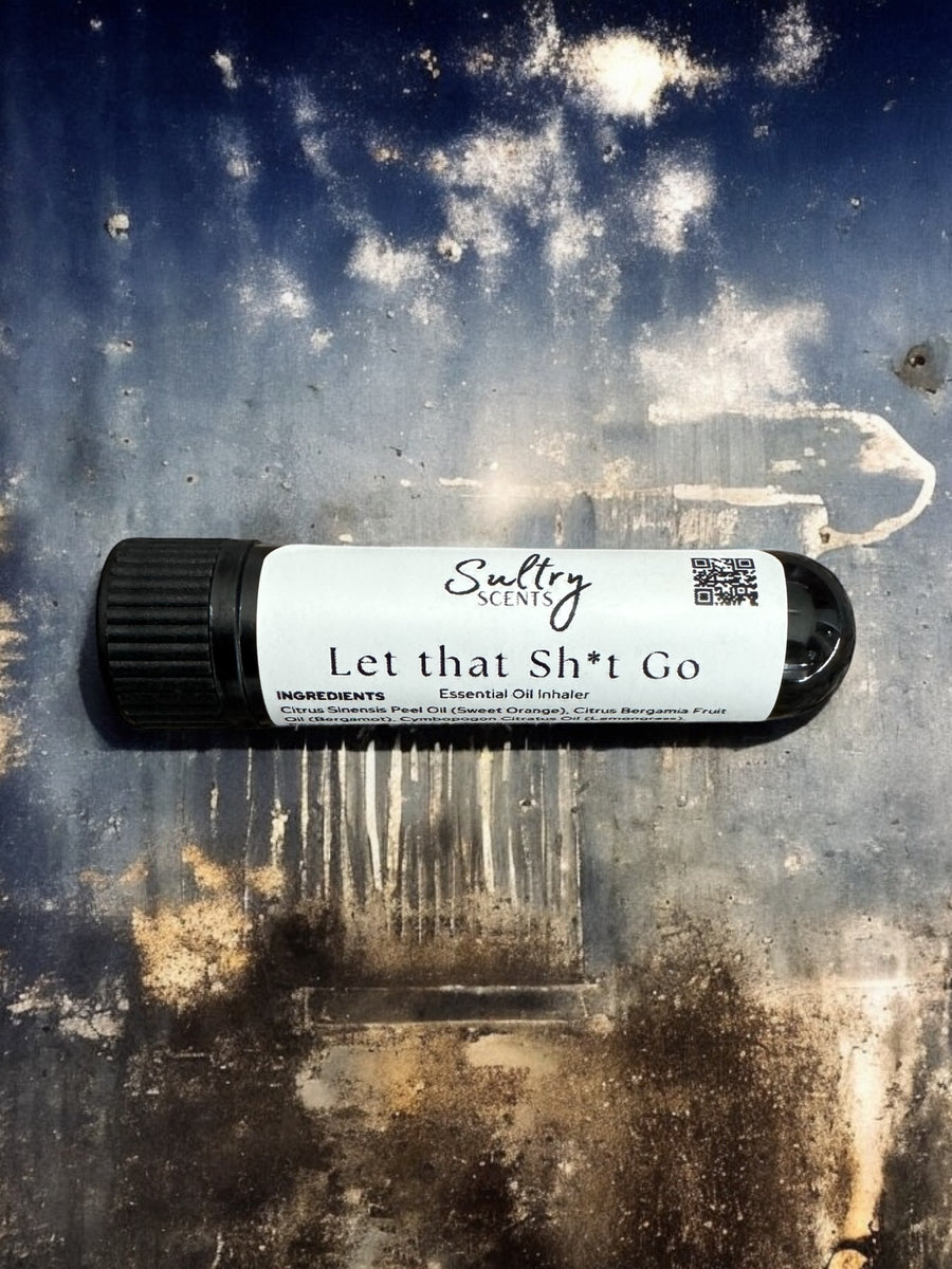 Sultry Scents Let that Sh*t Go Essential Oil Inhaler with black cap on textured surface