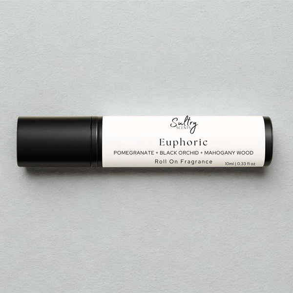 Euphoric roll on perfume inspired by CK Euphoria featuring pomegranate, black orchid, and mahogany wood