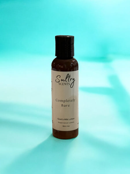 Sultry Scents goat milk body cream bottle labeled Completely Bare on blue background