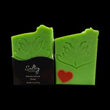 Holiday Grump soap bar by Sultry Scents, vibrant green with Grinch face and red heart
