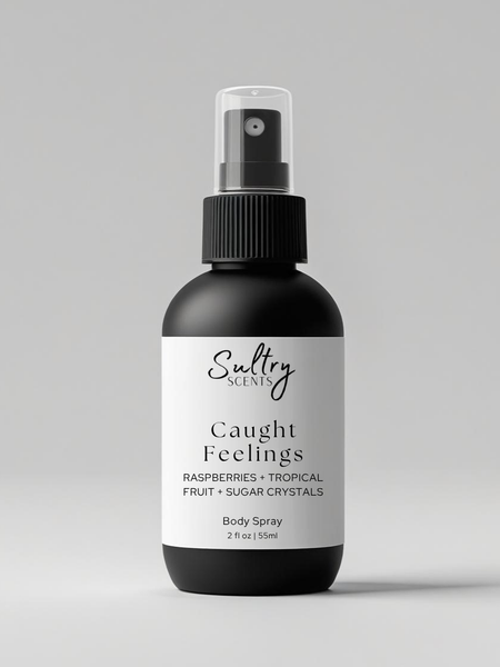 Sultry Scents Caught Feelings Body Spray with scent notes Raspberries and Tropical Fruit, in love with everything inspired perfume. Shows a 2 oz black bottle with white label.