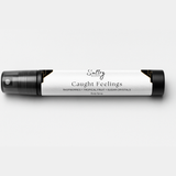 Sultry Scents Caught Feelings Body Spray with Raspberries, Tropical Fruit, and Sugar Crystals, In love with everything inspired perfume. Shows a 10 mL travel size spray bottle.