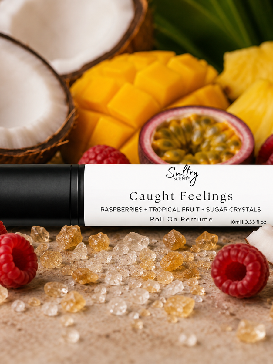 In Love with Everything Inspired Perfume with fruity notes of raspberries and tropical fruits around the roll-on perfume bottle.