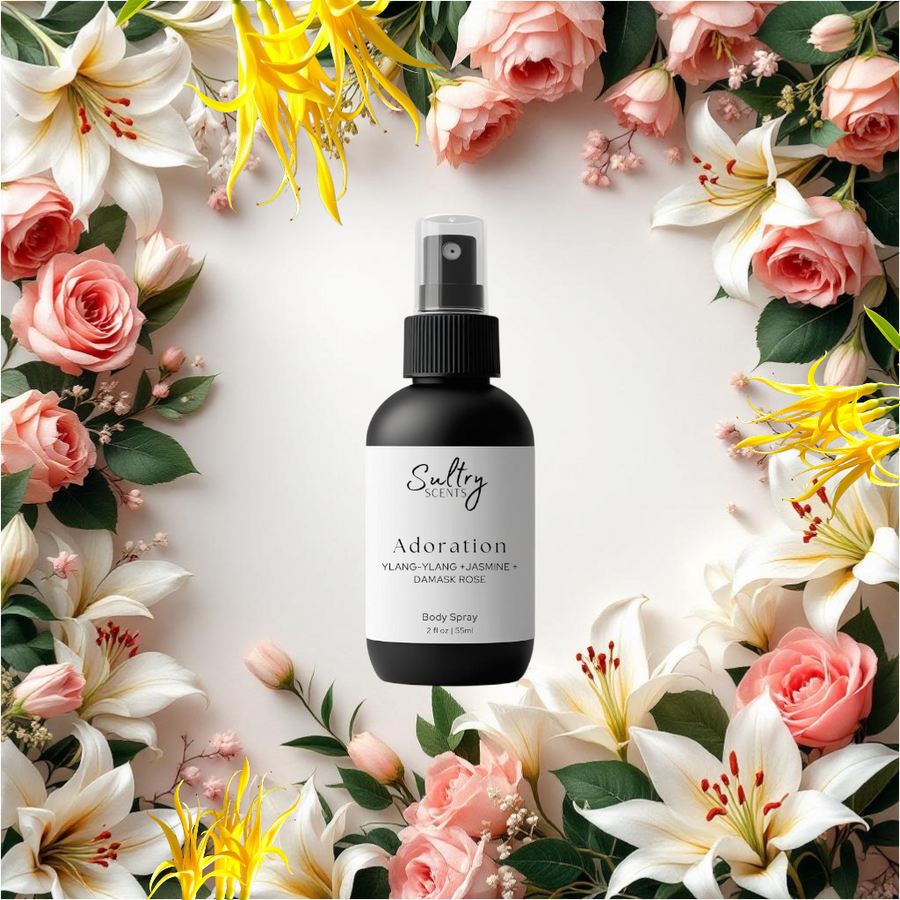 Sultry Scents Adoration bottle of J'adore inspired Body Spray with roses and lilies and ylang ylang backdrop