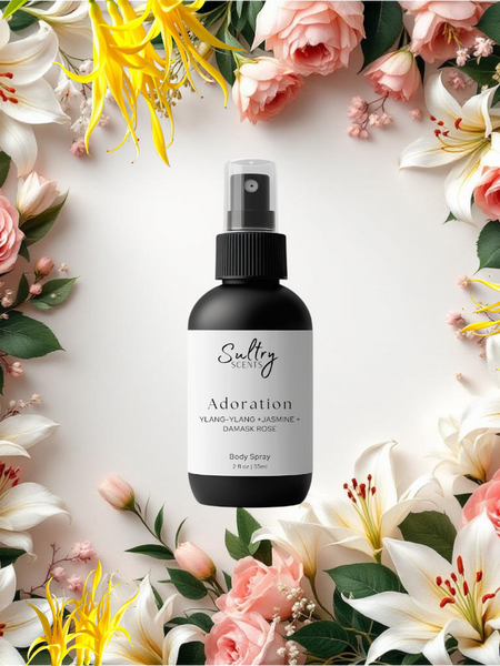Sultry Scents Adoration bottle of J'adore inspired Body Spray with roses and lilies and ylang ylang backdrop