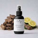 Sultry Scents Jo Malone Oud Bergamot dupe body spray in 2 oz bottle with citrus and wood background