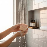 Person using Lavender Bergamot Tallow Soap bar while showering for a refreshing cleanse