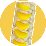 Lemon scented soap bar with creamy white base and yellow lemon slices on top