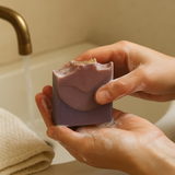 Sultry Scents luxury berry soap in a person's hands with lather for a rich bathing experience