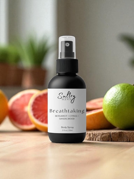 Sultry Scents luxury body spray citrus and sandalwood with bergamot in black spray bottle on wooden surface