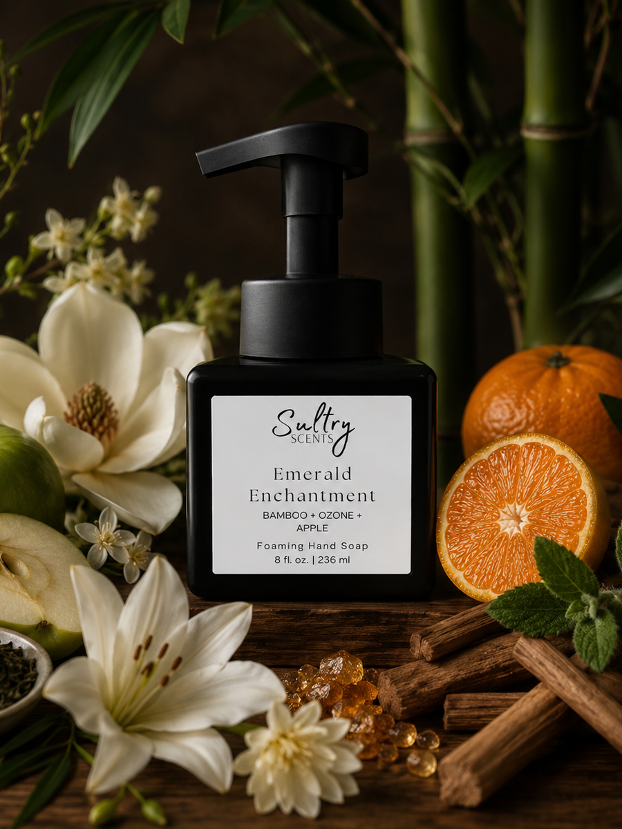 Sultry Scents Emerald Enchantment Luxury Foaming Hand Soap in a stylish black pump bottle surrounded with scent notes of bamboo, apple, mandarin, magnolia, amber, lily.