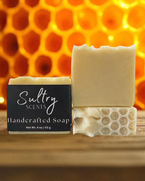 Sultry Scents handcrafted bar set on wood with honeycomb texture and natural Colloidal Oats goat milk Manuka honey soap