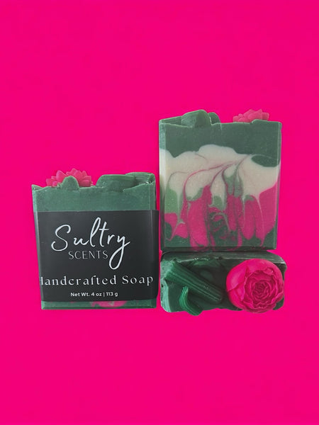 Pear Jam inspired handcrafted soap by Sultry Scents with green and pink swirls and floral decoration
