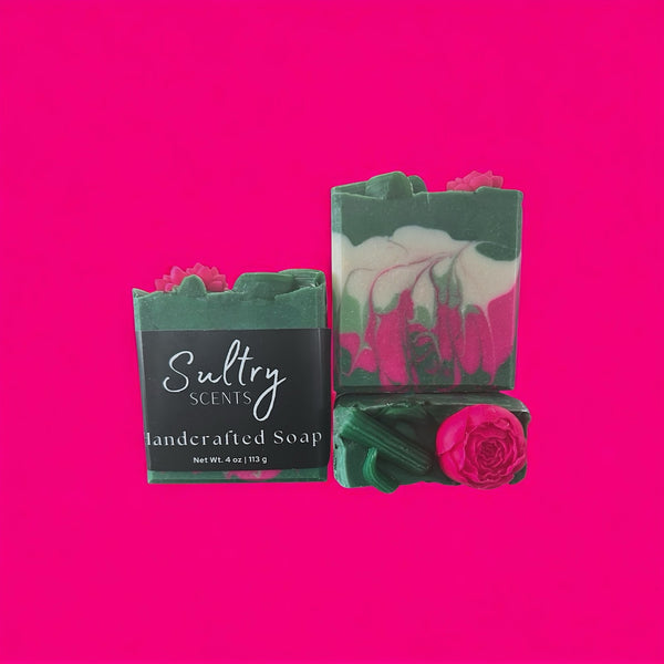 Pear Jam inspired handcrafted soap by Sultry Scents with green and pink swirls and floral decoration