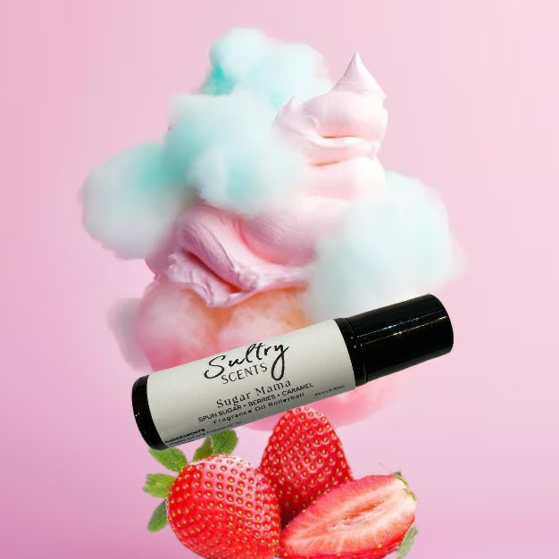 Sultry Scents Pink sugar dupe roll on perfume with strawberries and cotton candy background