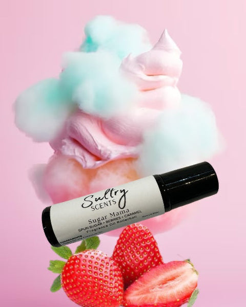 Sultry Scents Pink sugar inspired roll on perfume with strawberries and cotton candy background