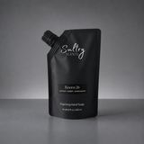 Room 26 foaming hand soap inspired by Santal 26 in a sleek black pouch for premium hand care