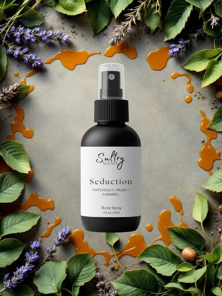 Black Sultry Scents Seduction body spray bottle on leaves lavender nuts and caramel drips seductive body spray inspired by Diva