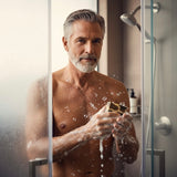 Man enjoying a shower while using Smoky Vanilla Woods soap bar for a refreshing cleanse