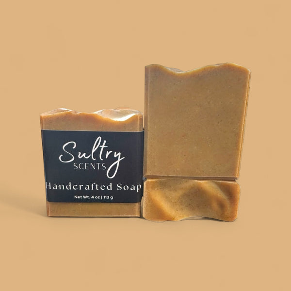 Sultry Scents tallow turmeric soap two handcrafted bars wrapped and unwrapped in warm golden turmeric color