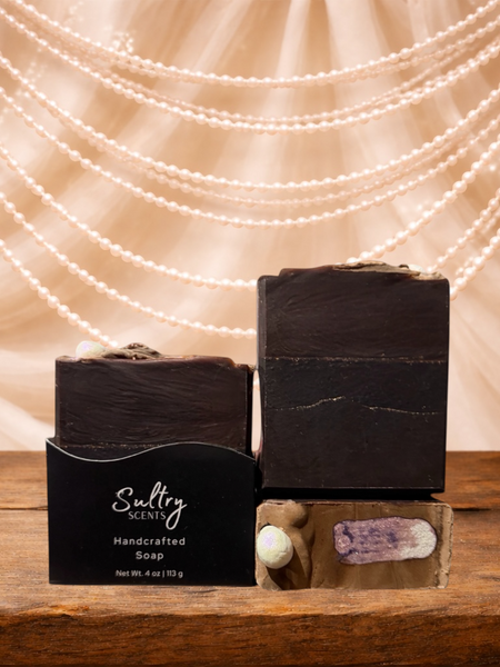 Sultry Scents handcrafted soap displayed on wooden surface with pearl backdrop, featuring vanilla skin inspired soap