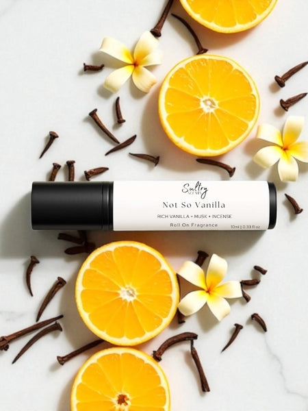 Sultry Scents Vanille 44 dupe roll on perfume with citrus and floral accents on marble background