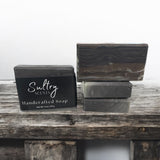 Sultry Scents handcrafted wood fragrance soap bars stacked on rustic wood for a natural aesthetic