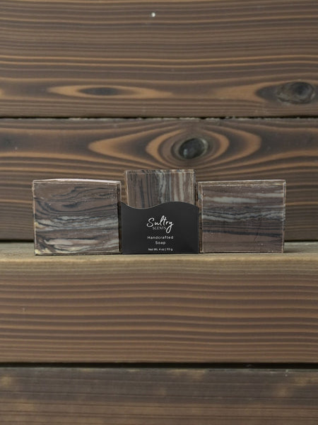 Wood fragrance soap that looks like wood in a rustic setting for a natural aesthetic