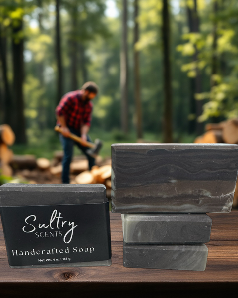 Sultry Scents wood fragrance soap that looks like wood displayed in a forest setting with logs