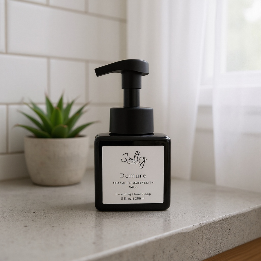 Sultry Scents black foaming pump bottle on bathroom counter with succulent Wood Sage & Sea Salt inspired foaming hand soap.