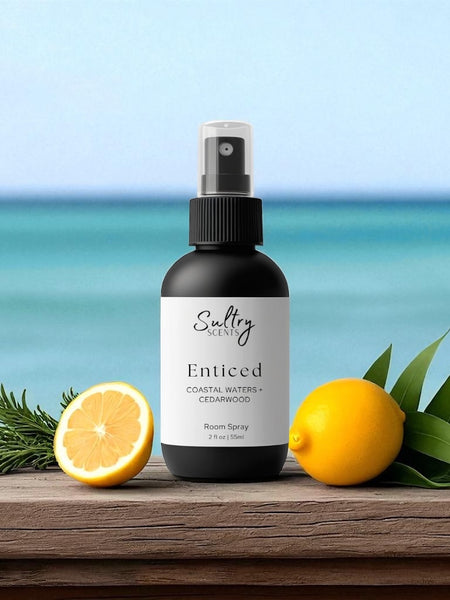 Sultry Scents Enticed odor eliminating luxury room spray bottle with lemons herbs on ocean backdrop