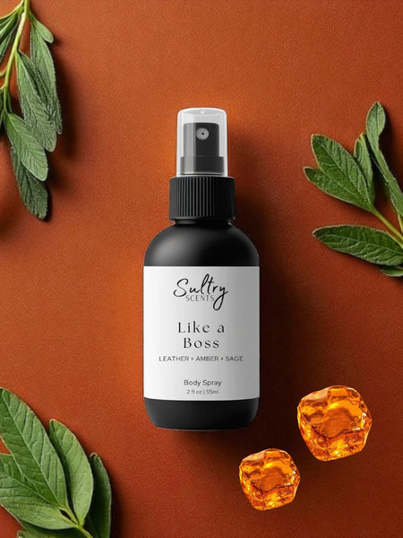Sultry Scents Like a Boss body spray bottle on brown background with green leaves and amber cubes Tom Ford Fucking Fabulous dupe