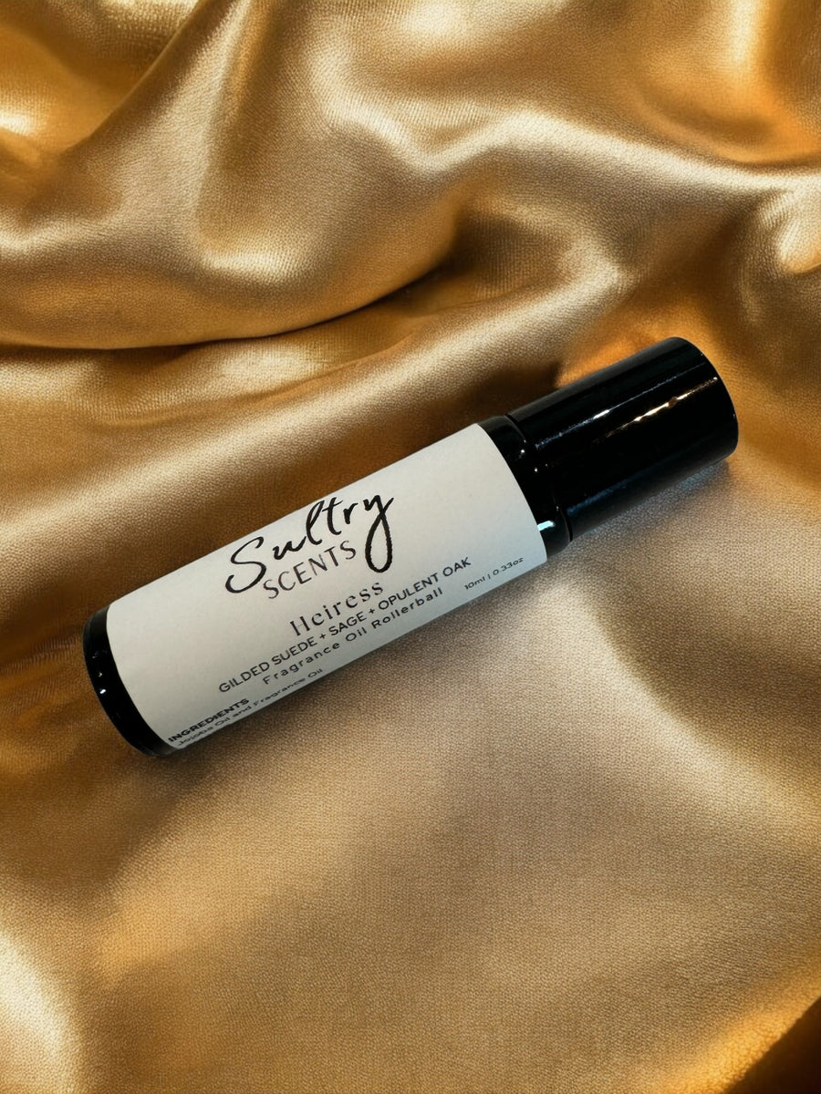 Sultry Scents Vetiver suede roll on perfume bottle on golden satin fabric background