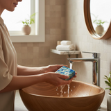 Person washing hands with Jo Malone Wood Sage & Sea Salt inspired soap at a modern bathroom sink